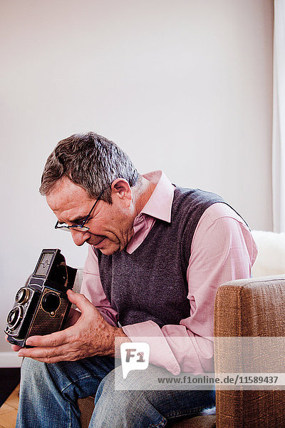 man playing with camera