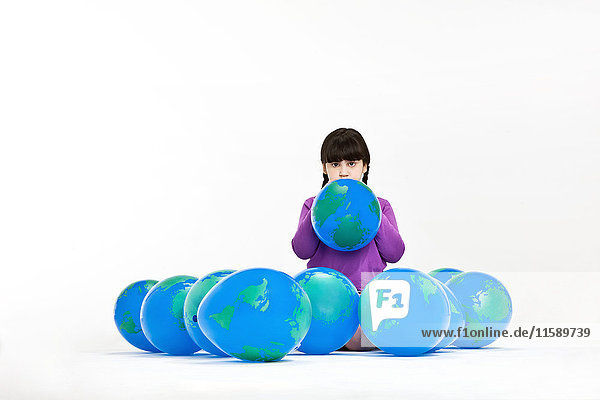 Girl with globe balloons