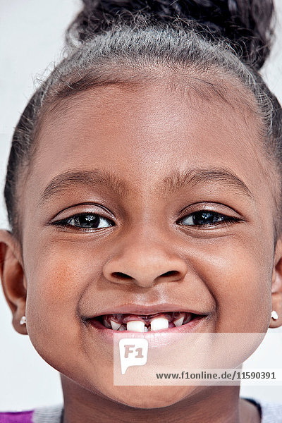 Girl smiling with gap tooth
