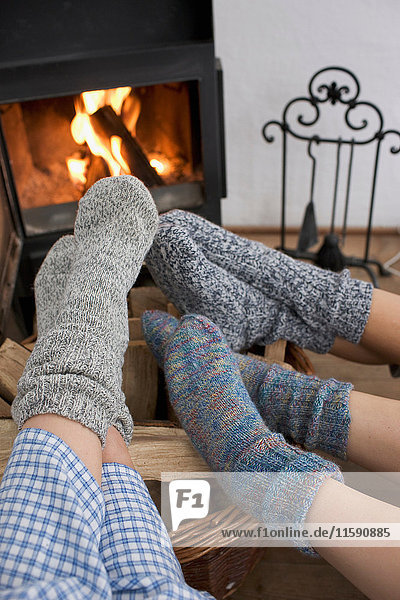Feet warming by the fireplace