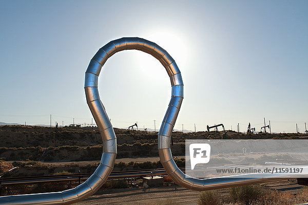 Curved pipe at oil field
