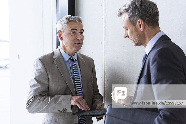 Two businessmen having an informal meeting