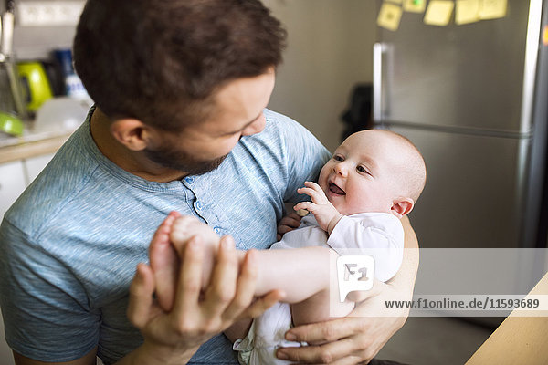 Father with baby son at home