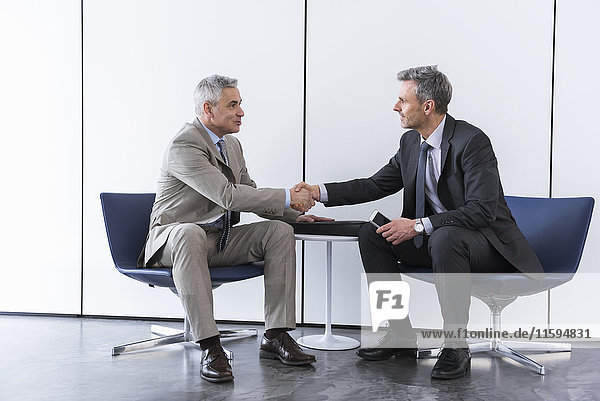 Business partners having a meeting  shaking hands