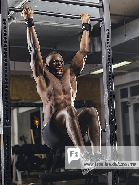 Athlete doing push ups in gym