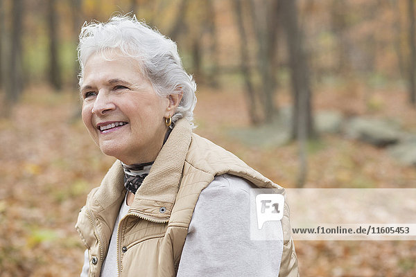 Caucasian woman smiling outdoors in autumn