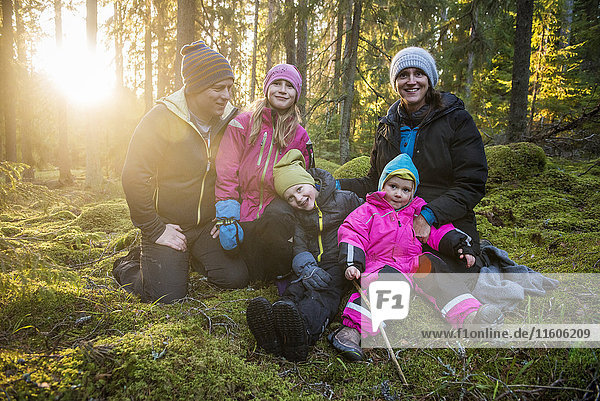 Happy family in forest