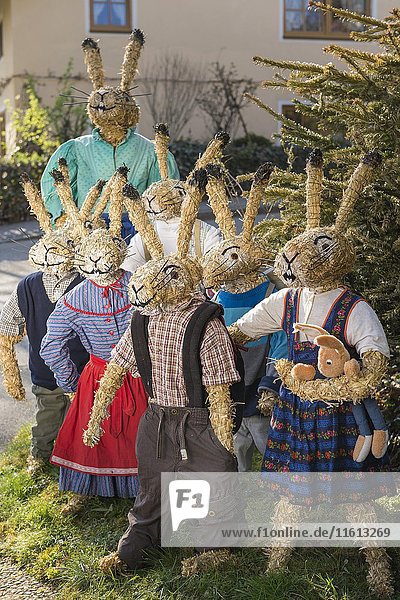 Easter bunnies as straw dolls  schoolchildren with teacher in bunny school  Niederneuching-Ottenhofen  Upper Bavaria  Bavaria  Germany  Europe