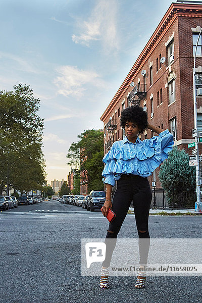 Portrait of young female fashion blogger on urban street  New York  USA
