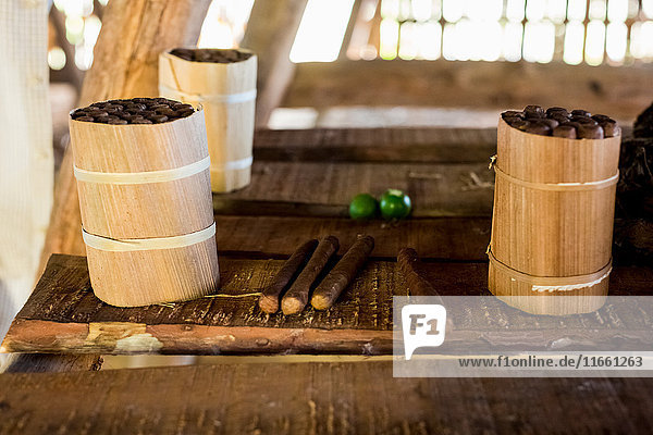 Three packages of hand made cuban cigars on workbench Vinales Cuba
