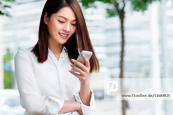 Young women using mobile phones