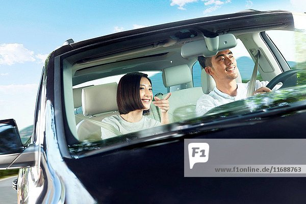 Young couple driving on trip