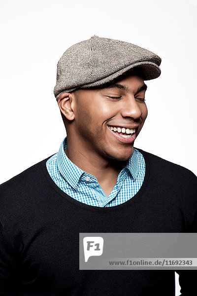 Portrait of man wearing cap  laughing