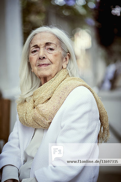 Portrait of serious older Caucasian woman wearing scarf