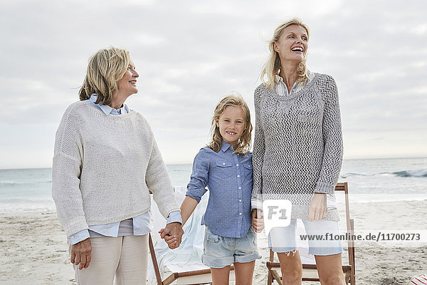 Mother daughter and grandmother spending a day at the beach