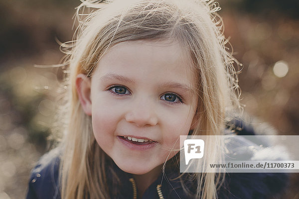 Portrait of a smiling girl outdoors