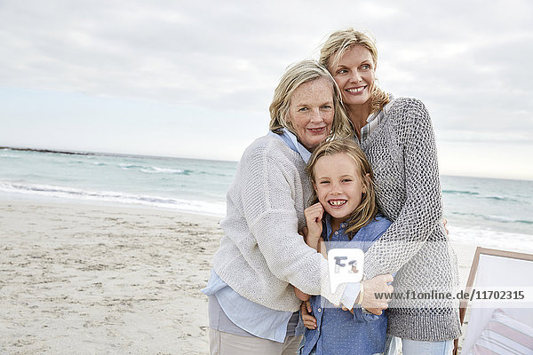 Mother daughter and grandmother spending a day at the beach