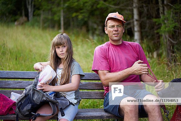Young girl with her father during hiking adventure
