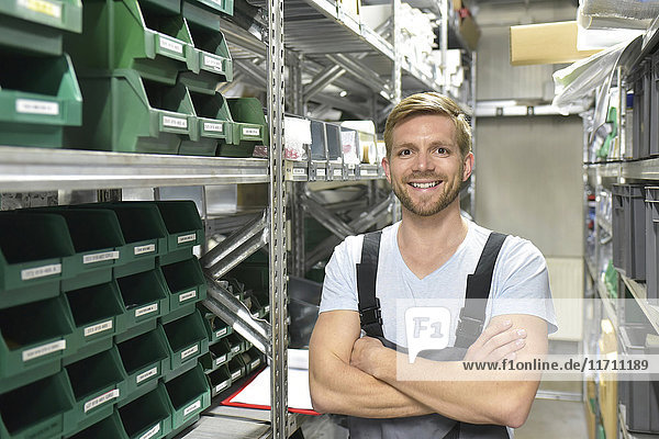 Portrait of smiling man in warehouse