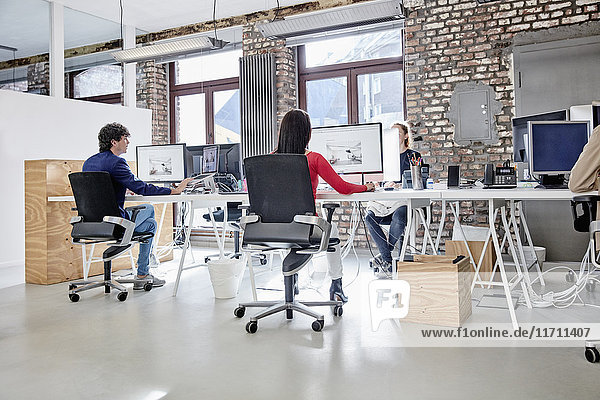 Group of people working in creative office
