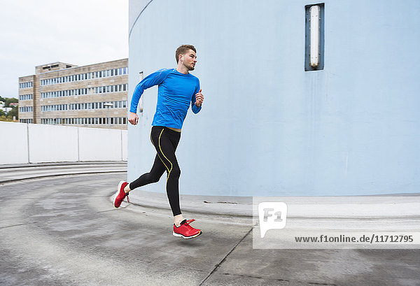 Young man running in the city