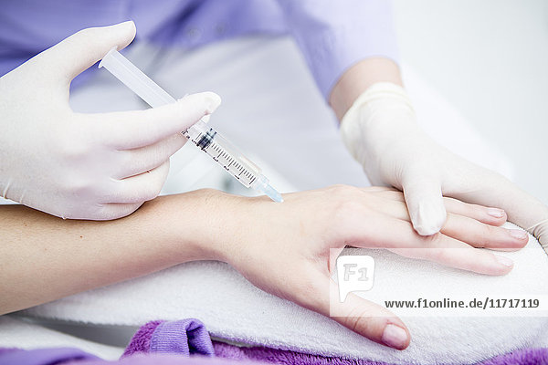 Aesthetic surgery  woman receiving injection