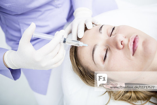 Aesthetic surgery  woman receiving injection