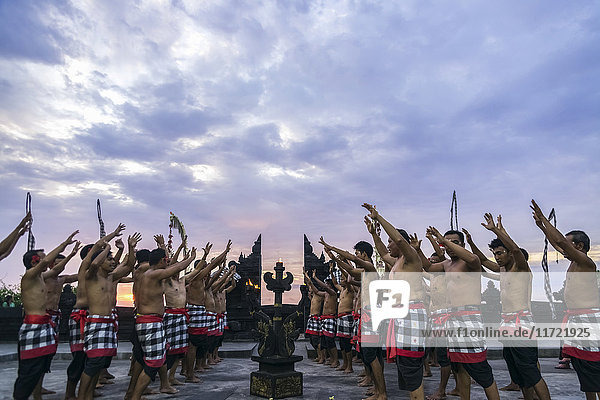 'Traditional Kecak ritual also called Fire Dance; Uluwatu Bali Island Indonesia'
