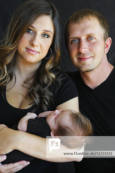 'Portrait of a husband and wife with their infant son; Oregon  United States of America'