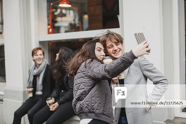 Teenagers taking selfie