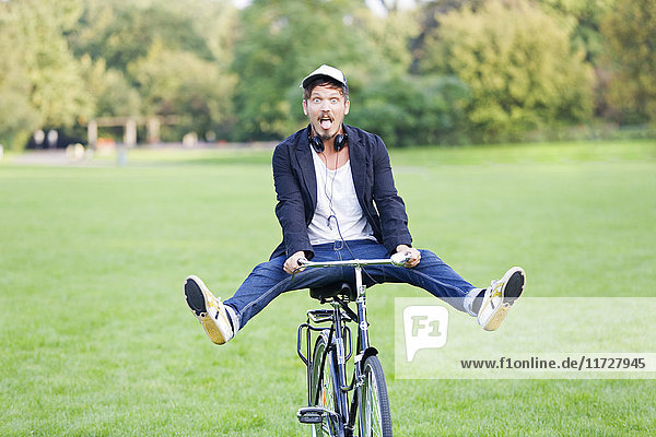 Man in park with bicycle