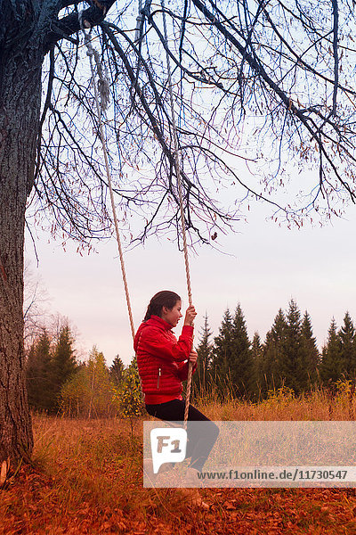 Girl on swing in park  Chusovoy  Russia