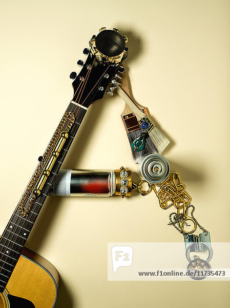 Guitar and jewellery in shape of letter A