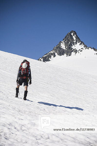 Man climbing the Sulfide Glacier on Mount Shuksan  North Cascades National Park  Washington  USA