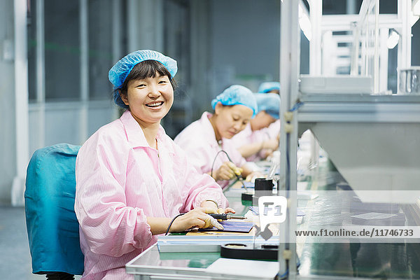 Female workers in solar panel assembly factory  Solar Valley  Dezhou  China