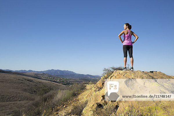 Mature female runner looking out from hill  Thousand Oaks  California  USA