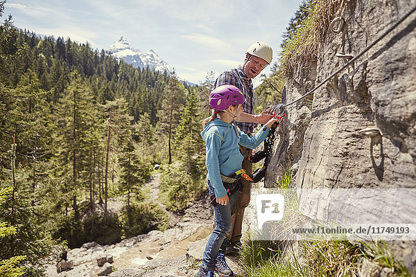 Father and child rock climbing  Ehrwald  Tyrol  Austria