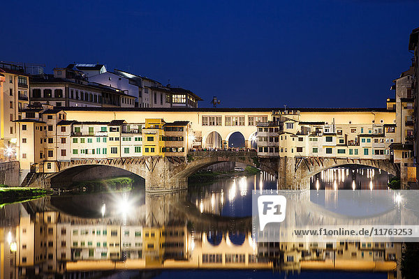 Ponte Vecchio at night reflecting in River Arno  Florence  UNESCO World Heritage Site  Tuscany  Italy  Europe