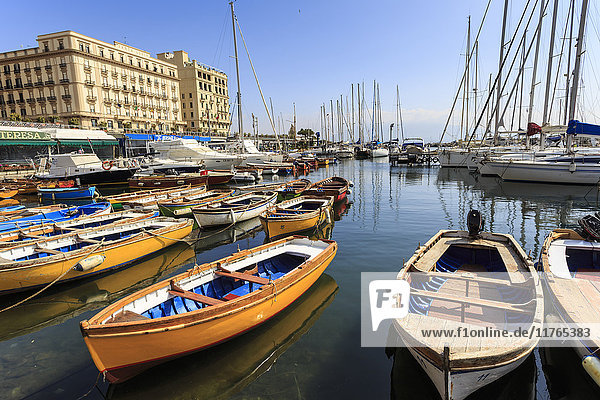 Yachts and colourful rowing boats in the marina Borgo Marinaro  Vesuvius in distance  Chiaia  City of Naples  Campania  Italy  Europe