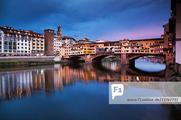 Ponte Vecchio at night reflected in the River Arno  Florence  UNESCO World Heritage Site  Tuscany  Italy  Europe