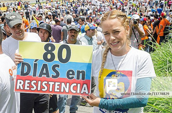 Lilian Tintori  wife of prominent jailed opposition leader Leopoldo Lopez  It shows a poster with the summary of the 80 days of protests  calling on the OAS. (OEA). The opposition made this Monday  June 19  the 'All to Caracas' march. Its objective is to bring together citizens of several states of the country in the capital and  along with Caracas  march to the National Electoral Council (CNE). That day marks 80 days since the protests against the Nicolás Maduro government began. Caracas  June  19  2017.