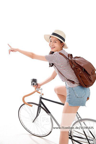 Young woman riding bicycle
