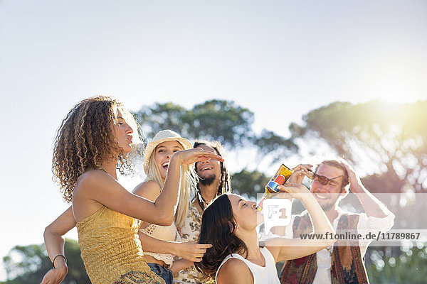 Happy young people outdoors having a good time