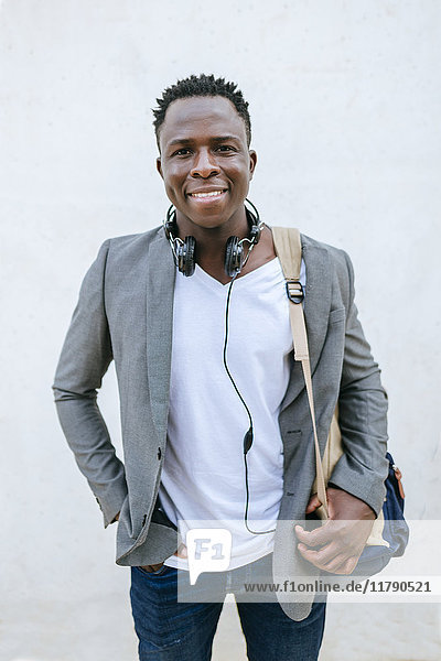 Portrait of smiling young man with backpack