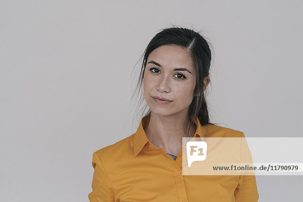 Portrait of a young woman looking sceptical