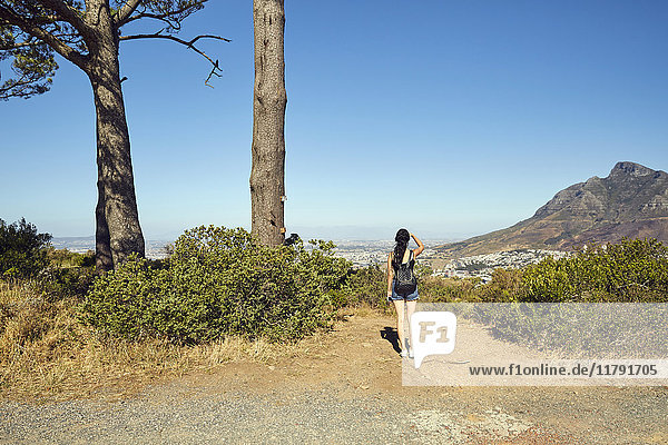 South Africa  Cape Town  Signal Hill  young woman overlooking the city