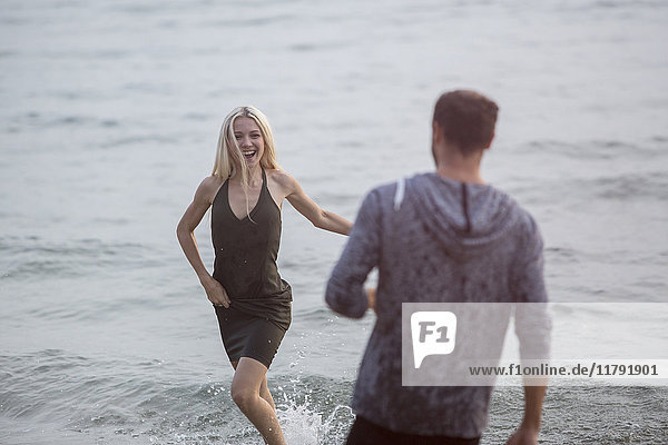 Happy couple having fun in the sea