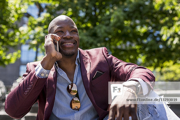 Portrait of smiling businessman on the phone