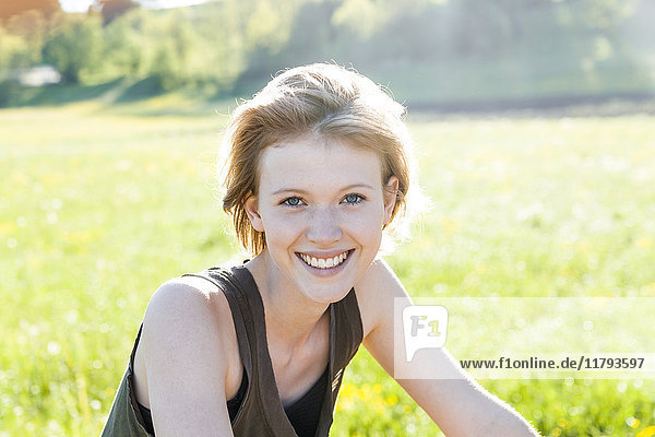 Portrait of smiling young woman in nature