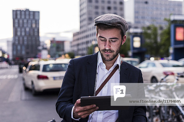 Young man in the city with tablet